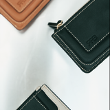 Cartera Binomio de piel negra con cremallera